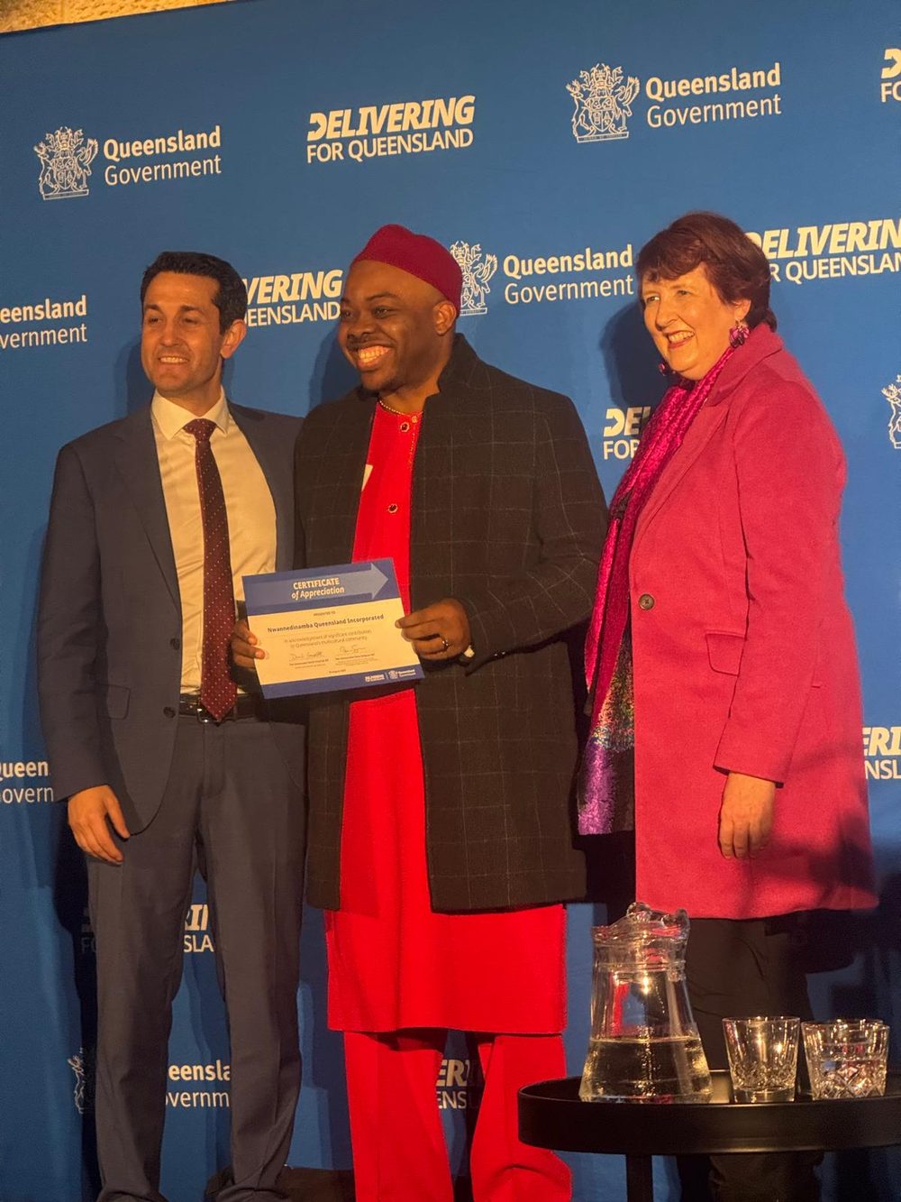 A Nwannedinamba representative receiving a Queensland Government Certificate of Appreciation